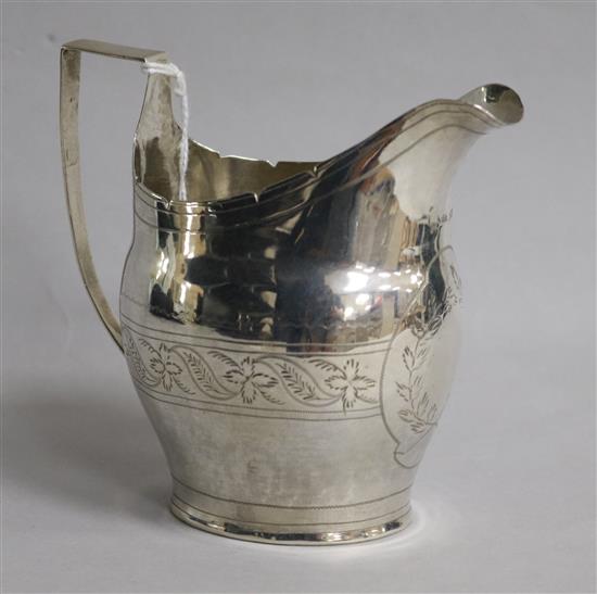 A George III engraved silver helmet shaped cream jug, 3 oz.